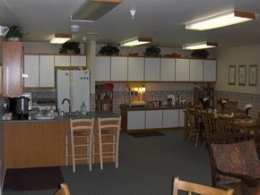 Nampa apartment for rent - a kitchen with a table and chairs and a counter top