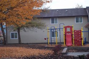 Moscow apartment for rent - a house with a playground and a tree in the yard