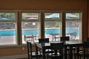 Boise apartment for rent - a dining room with a view of a swimming pool