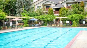 Boise apartment for rent - a swimming pool in front of a house with a pool