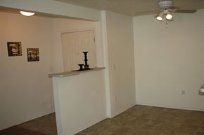 Nampa apartment for rent - a living room with a white wall and a ceiling fan