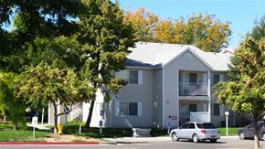 Nampa apartment for rent - a white house with a car parked in front of it