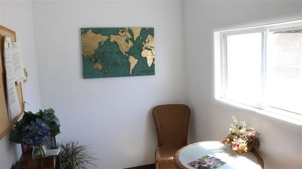 Payette apartment for rent - a dining room with a table and a map on the wall