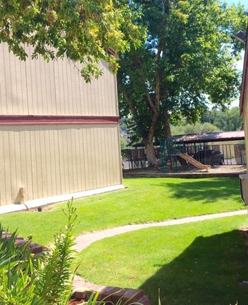 Pendleton apartment for rent - a backyard with a playground and a tree