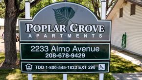 Burley apartment for rent - a sign for popular grove apartments in front of a house
