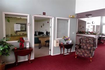 Caldwell apartment for rent - a living room with a chair and a table