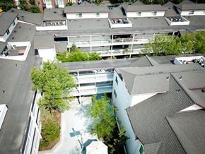 Boise apartment for rent - an aerial view of an office building with a pool in the middle