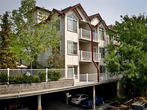 Boise apartment for rent - an apartment building with a parking ramp in front of it