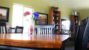 Heyburn apartment for rent - a dining room table with a vase of flowers on it