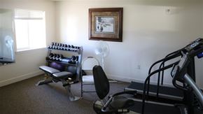 Idaho Falls apartment for rent - a gym with a chair and equipment in a room