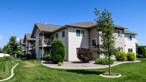 Idaho Falls apartment for rent - an apartment building with a yard and trees