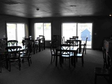 Caldwell apartment for rent - a dining room with tables and chairs and windows