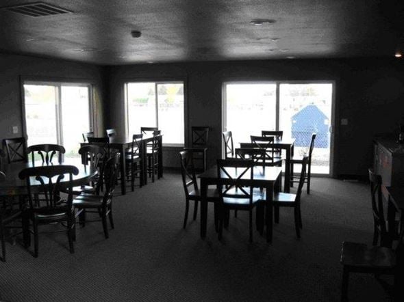 Caldwell apartment for rent - a dining room with tables and chairs and windows