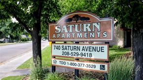 Idaho Falls apartment for rent - a sign for the saturn apartments on the side of the street