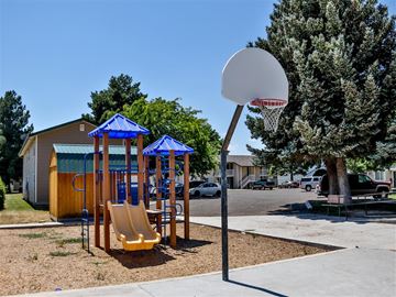 Burley apartment for rent - a playground with a basketball hoop and a swing set