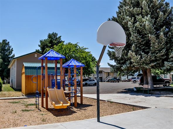 Burley apartment for rent - a playground with a basketball hoop and a swing set