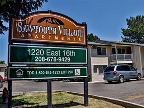 Burley apartment for rent - a sign for the savannah village apartments is shown in front of a house