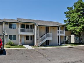 Burley apartment for rent - an apartment building with two balconies and a parking lot