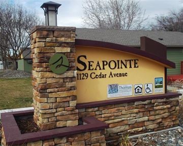 Lewiston apartment for rent - a sign for seapoint 112 cedar avenue in front of a building