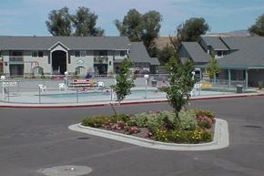 Garden City apartment for rent - a swimming pool in the middle of a parking lot