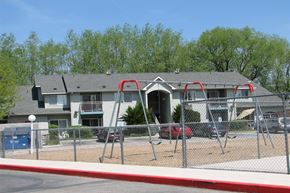 Garden City apartment for rent - a playground with a house in the background