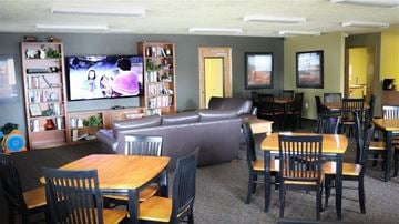 Mountain Home apartment for rent - a living room with tables and chairs and a tv