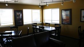 Rupert apartment for rent - a dining room with tables and chairs and windows