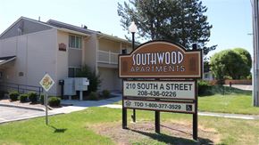 Rupert apartment for rent - a sign for southwood apartments in front of a building