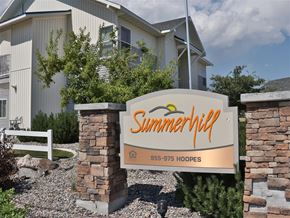 Idaho Falls apartment for rent - a sign for summerhill apartments in front of a building
