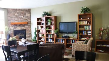 Idaho Falls apartment for rent - a living room with a couch and a table and a television