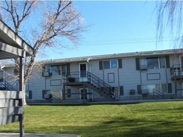 Buhl apartment for rent - a white building with a lawn in front of it