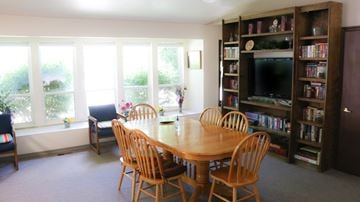 Mountain Home apartment for rent - a dining room with a wooden table and chairs and bookshelves