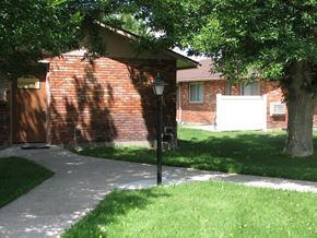 Rupert apartment for rent - a sidewalk in front of a brick house