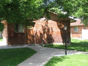 Rupert apartment for rent - a brick house with a sidewalk in front of it