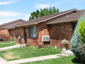 Rupert apartment for rent - a brick house with a lawn in front of it