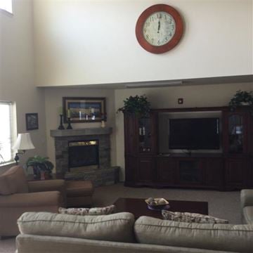 Lewiston apartment for rent - a living room with a couch and a clock on the wall