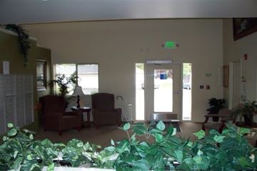 Lewiston apartment for rent - a living room with a couch and chairs and plants