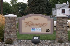 Lewiston apartment for rent - a sign in front of a house on the grass