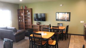 Rupert apartment for rent - a dining room and living room with a table and a tv