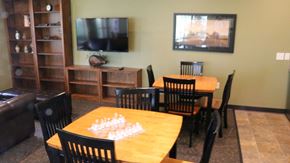 Rupert apartment for rent - a dining room with tables and chairs and a flat screen tv