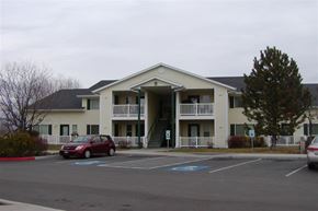 Kuna apartment for rent - a building with a red car parked in front of it