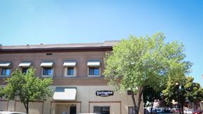 Nampa apartment for rent - a large brick building with trees in front of it