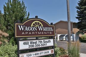 Rexburg apartment for rent - a sign apartments in front of a building