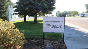 American Falls apartment for rent - a sign that reads welcome home in front of a street
