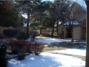 Boise apartment for rent - a snow covered yard in front of a house