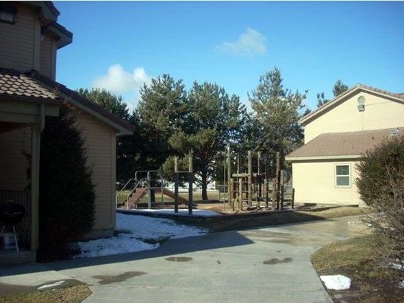 Boise apartment for rent - a backyard with a playground and a house