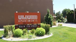 Weiser apartment for rent - a sign for willow apartments in front of a building
