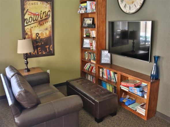 Weiser apartment for rent - a living room with a leather couch and a tv