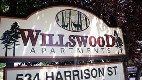 Twin Falls apartment for rent - a sign that says wildwood apartments in front of a tree