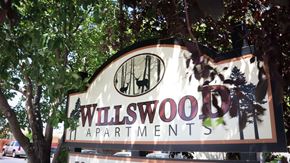 Twin Falls apartment for rent - a sign for willwood apartments in front of trees